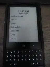 Minimal Phone displaying the home screen and in a slightly crapp 3D printed case.