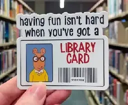 Image shows popular kid's cartoon and book series main character, Arthur. His picture is on his library card with a caption that says "having fun isn't hard when you've got a library card"