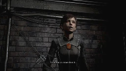 Rebecca wearing "team Wesker" costume, saying: Now that's more like it!