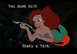 A screenshot from disneys the little mermaid where Ariel is swimming under water in her treasure cave holding and looking at a fork, which she called a "dinglehopper" in the movie